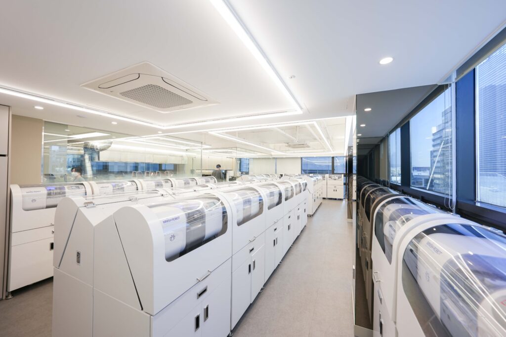 Room filled with advanced MINISH veneer technology machines used for precision dental treatment.